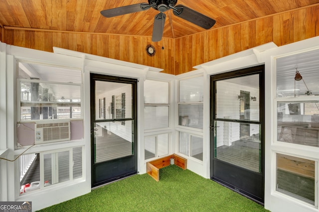 unfurnished sunroom with cooling unit and ceiling fan