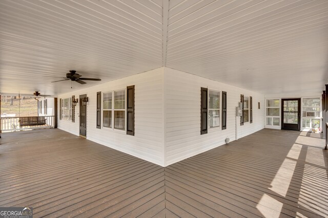 deck featuring a porch and ceiling fan