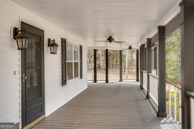 wooden terrace with a porch