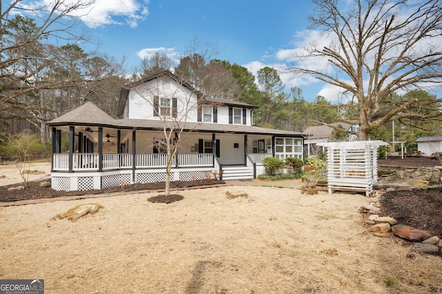 view of front of property with a porch and a shingled roof