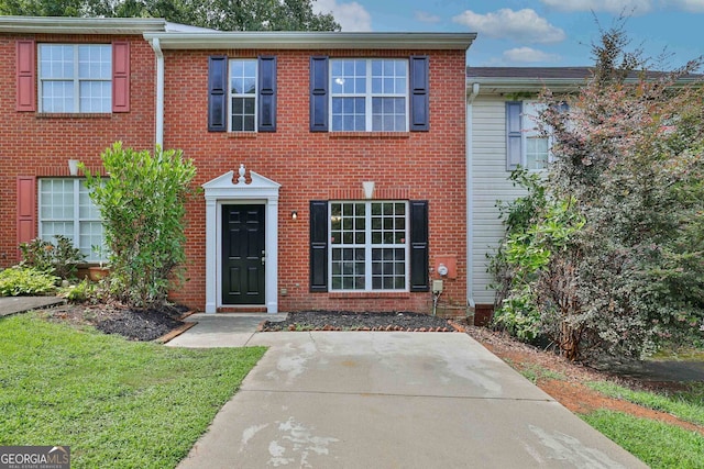 view of front of property featuring brick siding