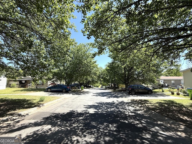 view of street with curbs