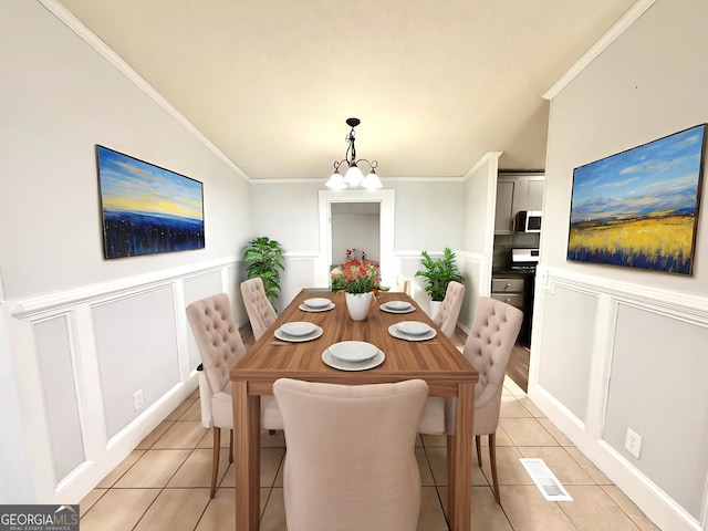 750 Six Flags Rd Lot 417, Austell, GA 30168 - dining area with light tile patterned floors, a chandelier, ornamental molding, and a decorative wall