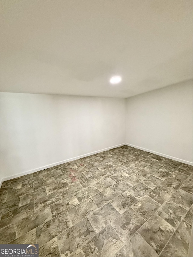 750 Six Flags Rd Lot 417, Austell, GA 30168 - empty room with baseboards and stone finish flooring
