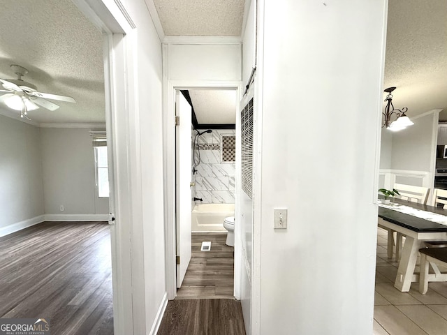 750 Six Flags Rd Lot 417, Austell, GA 30168 - hallway with a textured ceiling, ornamental molding, wood finished floors, and baseboards
