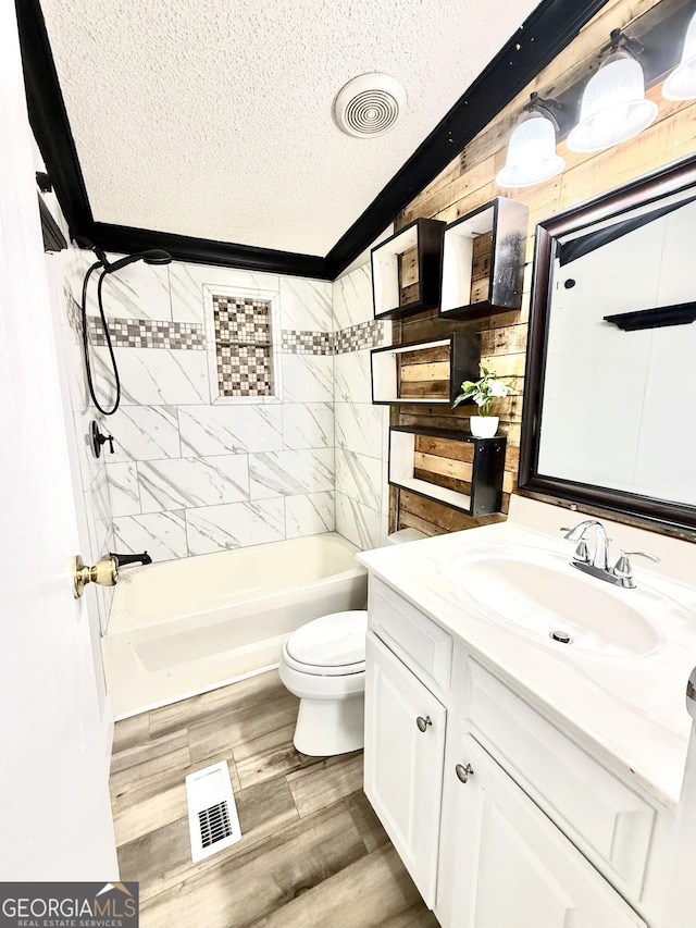 750 Six Flags Rd Lot 417, Austell, GA 30168 - full bathroom with a textured ceiling, vanity, toilet, wood finished floors, and bathing tub / shower combination