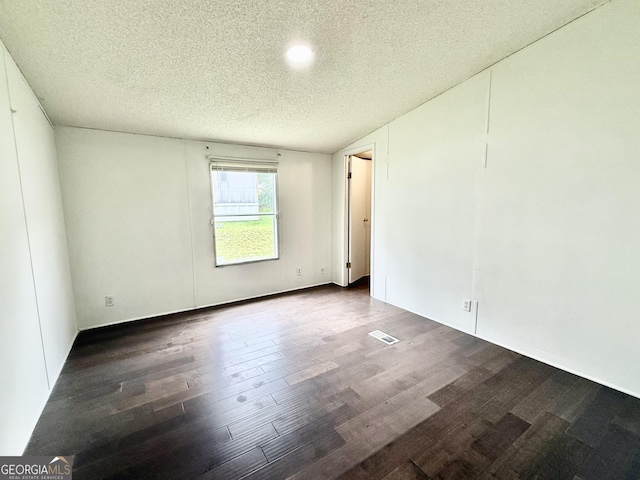 750 Six Flags Rd Lot 417, Austell, GA 30168 - empty room featuring wood finished floors and a textured ceiling
