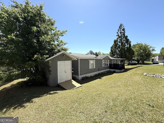750 Six Flags Rd Lot 417, Austell, GA 30168 - view of property exterior featuring a yard