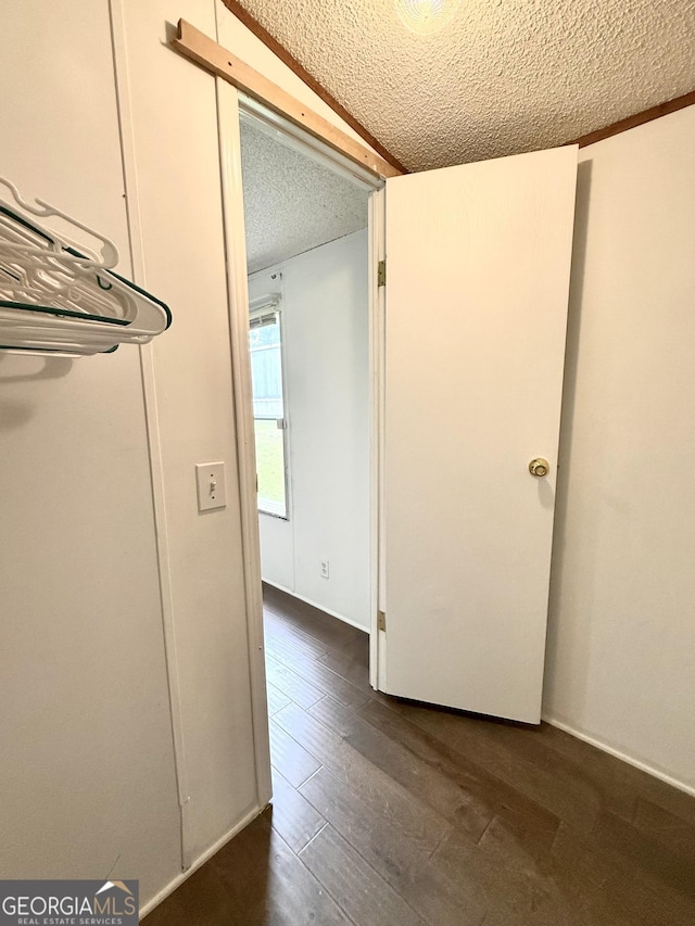 750 Six Flags Rd Lot 417, Austell, GA 30168 - empty room featuring a textured ceiling and dark wood-type flooring