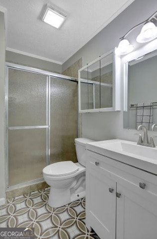 full bath with a shower stall, vanity, ornamental molding, and toilet
