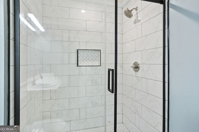 bathroom with a shower stall
