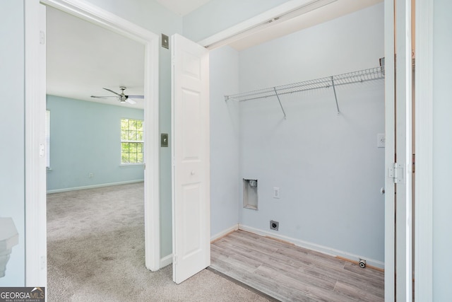 clothes washing area featuring laundry area, carpet, a ceiling fan, baseboards, and hookup for an electric dryer