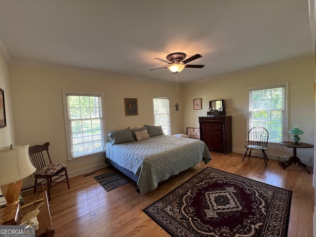 135 Southlake Dr, Moultrie, GA 31768 - bedroom featuring ornamental molding, light wood finished floors, baseboards, and a ceiling fan