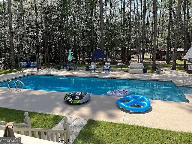 135 Southlake Dr, Moultrie, GA 31768 - outdoor pool featuring a patio