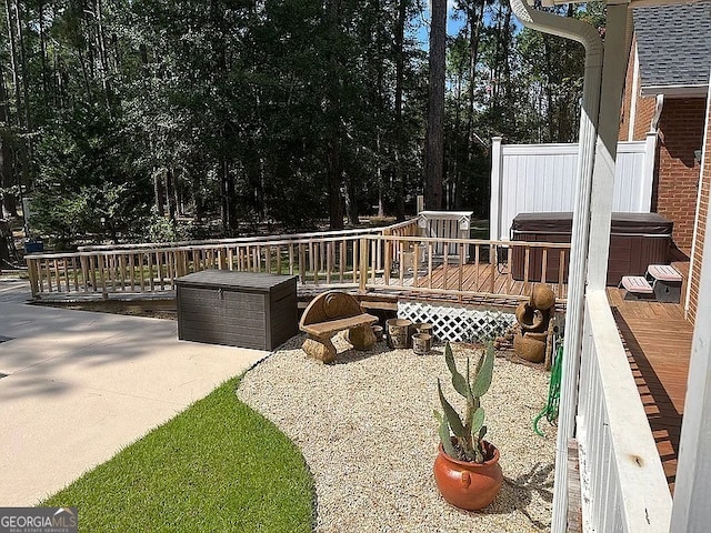 135 Southlake Dr, Moultrie, GA 31768 - wooden deck with a hot tub and a patio area