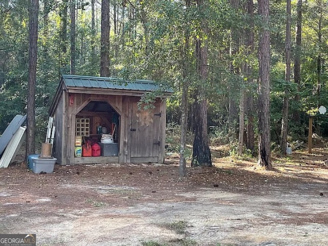 135 Southlake Dr, Moultrie, GA 31768 - view of shed featuring a wooded view