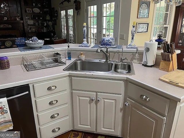 135 Southlake Dr, Moultrie, GA 31768 - kitchen featuring a sink, light countertops, white cabinetry, and dishwasher