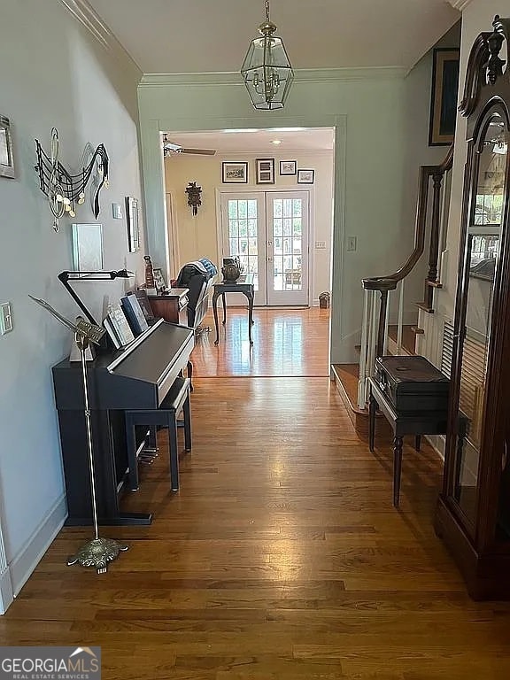 135 Southlake Dr, Moultrie, GA 31768 - foyer entrance with crown molding, wood finished floors, stairs, and baseboards