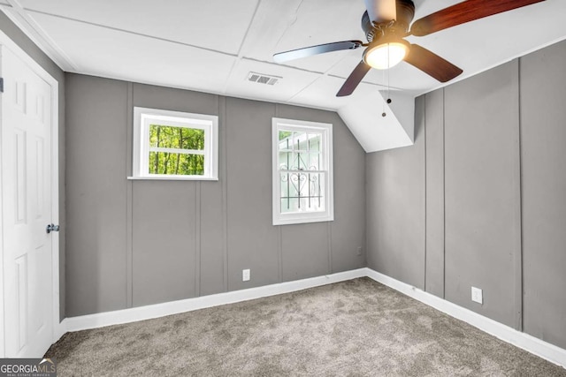 additional living space with carpet flooring, ceiling fan, and baseboards
