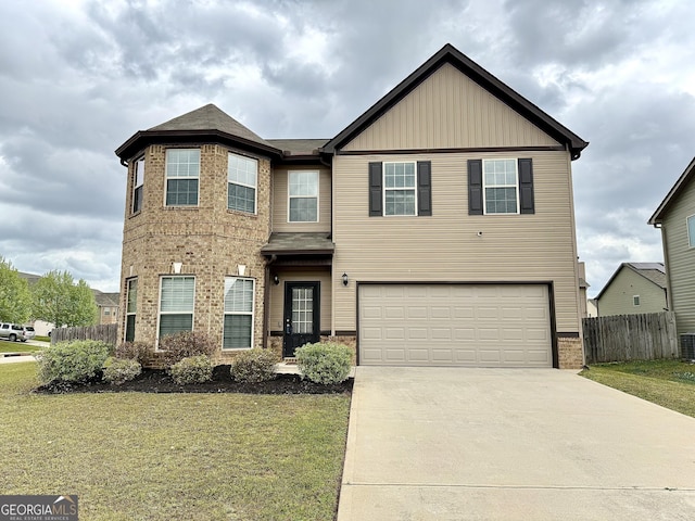 191 Amelia Dr, Byron, GA 31008 - view of front of house featuring an attached garage, driveway, brick siding, central AC, and board and batten siding