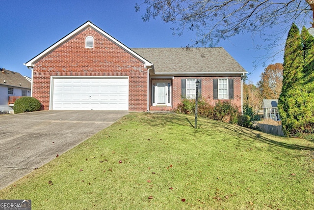 view of front of house with a front yard, brick siding, driveway, and an attached garage