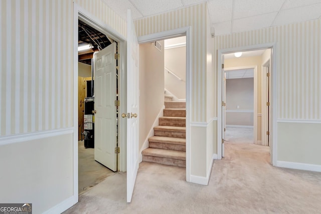 stairway featuring carpet, baseboards, and wallpapered walls