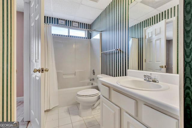 bathroom with shower / tub combo, toilet, a paneled ceiling, vanity, and wallpapered walls