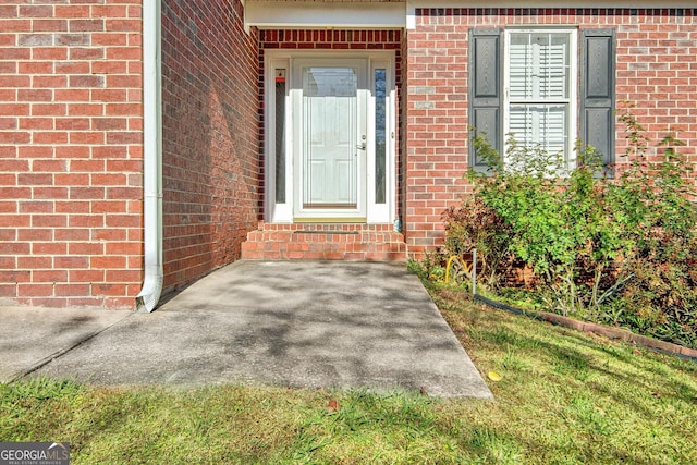 entrance to property with brick siding