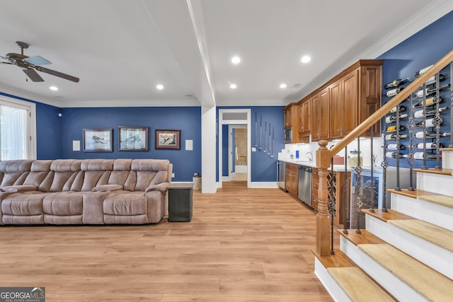 1021 Homestead, Greensboro, GA 30642 - living area featuring ornamental molding, stairs, a ceiling fan, baseboards, and light wood-style floors