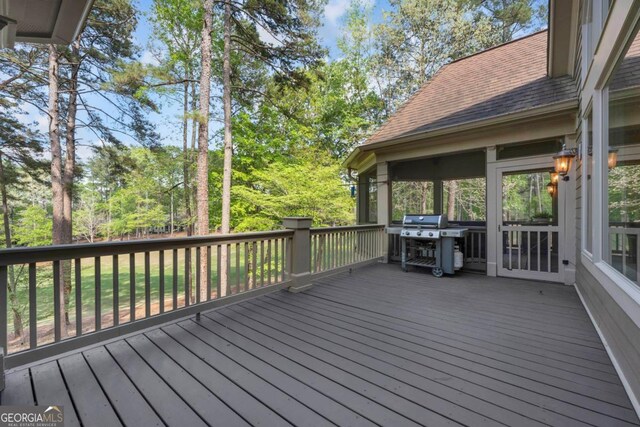 1021 Homestead, Greensboro, GA 30642 - wooden deck featuring a grill and view of scattered trees