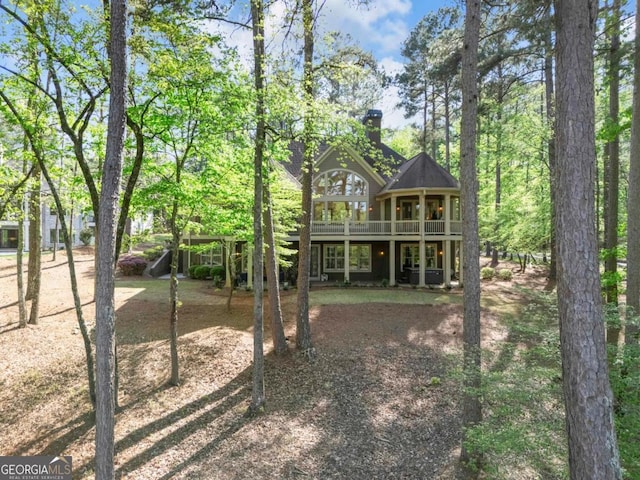 1021 Homestead, Greensboro, GA 30642 - rear view of property with a wooden deck and a chimney