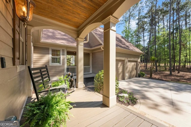 1021 Homestead, Greensboro, GA 30642 - porch featuring concrete driveway and a garage