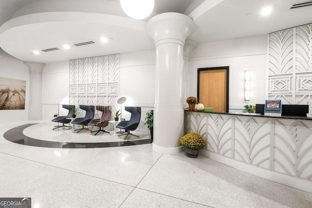 reception with visible vents and decorative columns