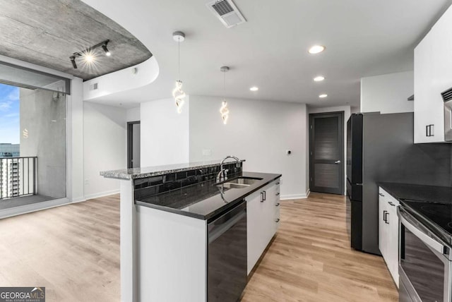 kitchen with light wood-style flooring, visible vents, dishwasher, a sink, and stainless steel electric range