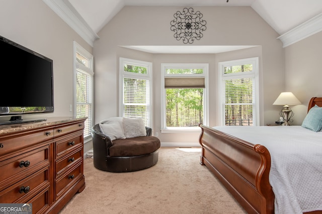 bedroom with light colored carpet, vaulted ceiling, and crown molding