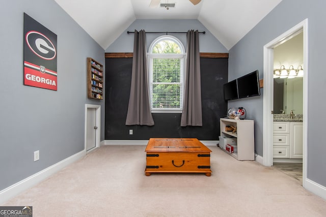 recreation room with baseboards, vaulted ceiling, carpet flooring, visible vents, and ceiling fan