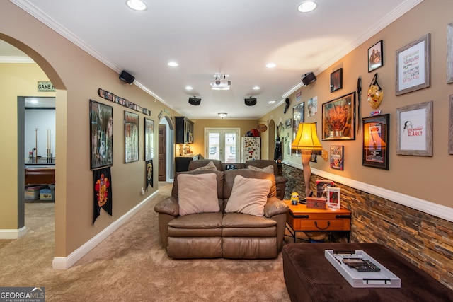 living room featuring carpet, arched walkways, ornamental molding, recessed lighting, and baseboards