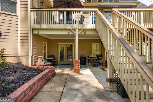 back of house featuring a patio, french doors, and stairs