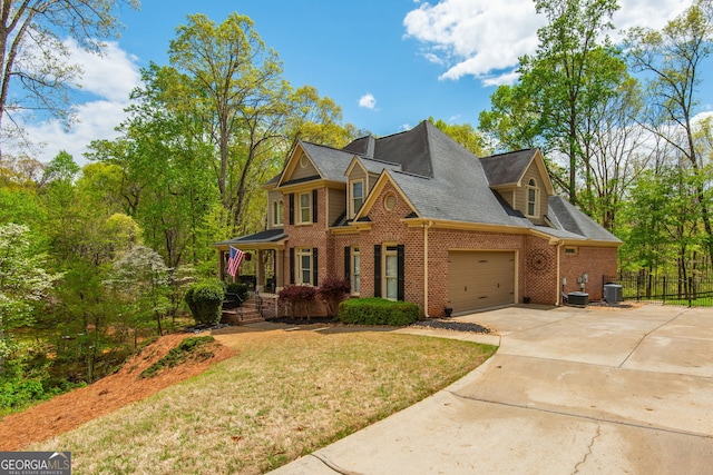 view of front of house featuring brick siding, driveway, central AC, and a front lawn