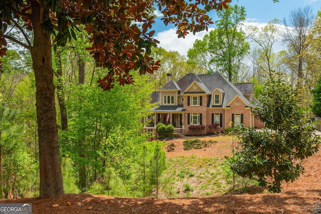view of front of home featuring brick siding