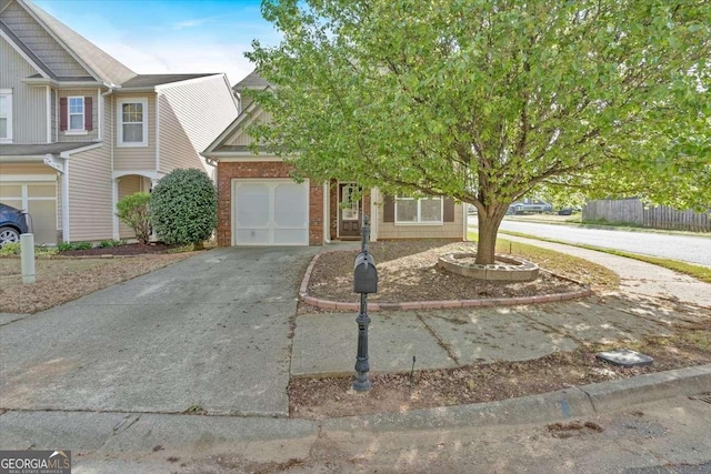 200 Arrowhead Ln, Canton, GA 30114 - townhome / multi-family property featuring concrete driveway, a garage, and brick siding