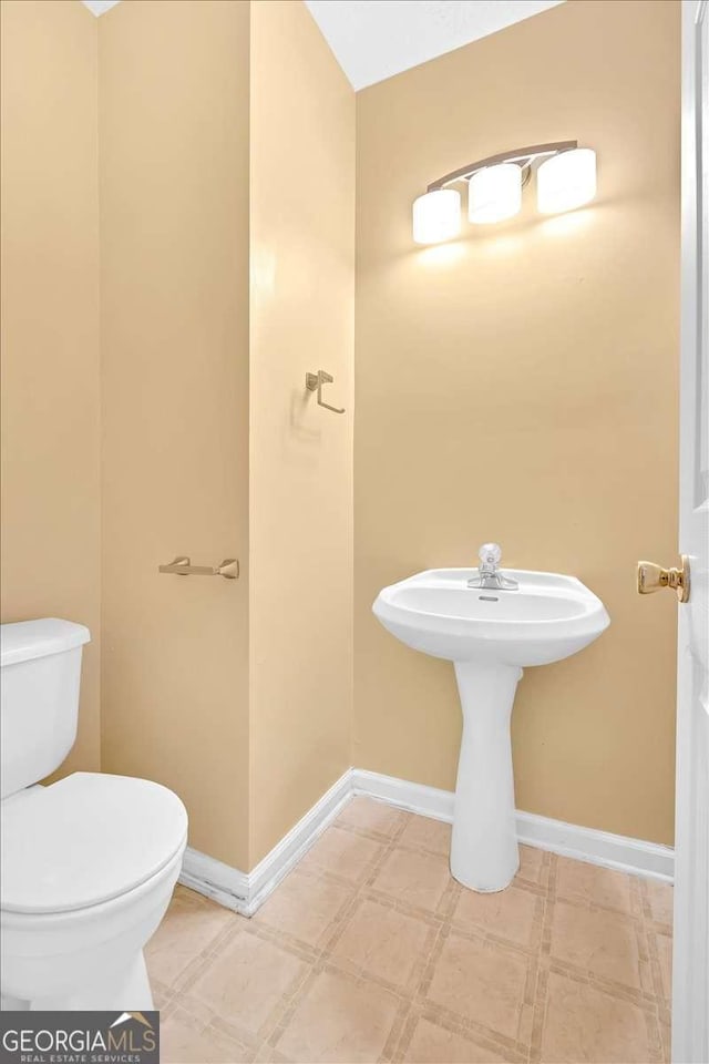200 Arrowhead Ln, Canton, GA 30114 - bathroom with tile patterned floors, toilet, and baseboards