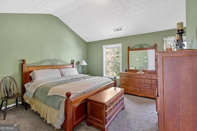 200 Arrowhead Ln, Canton, GA 30114 - bedroom with a textured ceiling, lofted ceiling, visible vents, and carpet floors