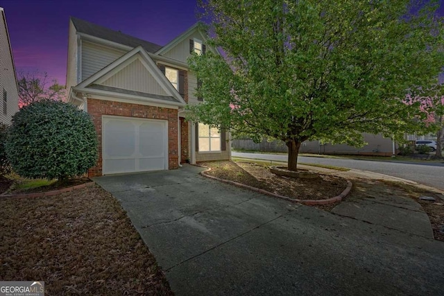 200 Arrowhead Ln, Canton, GA 30114 - view of front facade with a garage, brick siding, and driveway
