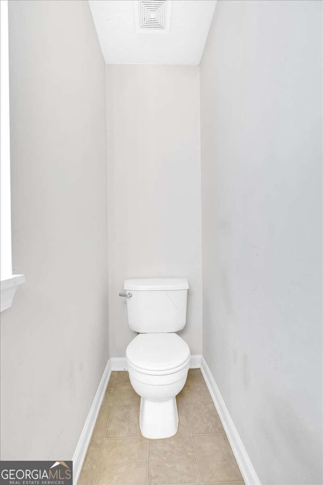 200 Arrowhead Ln, Canton, GA 30114 - bathroom featuring toilet, tile patterned flooring, and baseboards