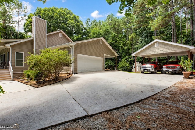 view of home's exterior with a chimney, concrete driveway, and a carport