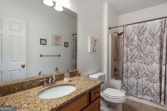 bathroom featuring toilet, vanity, tile patterned flooring, and shower / bath combo with shower curtain