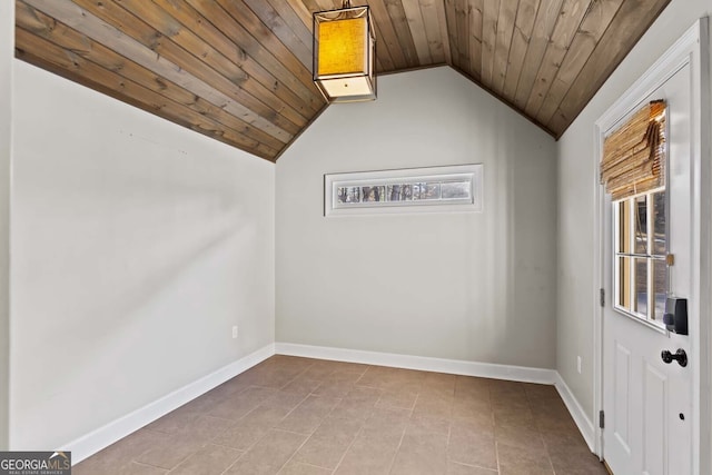tiled empty room featuring wooden ceiling, baseboards, and vaulted ceiling