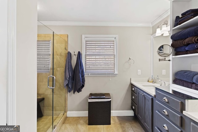 bathroom featuring vanity, baseboards, ornamental molding, and a stall shower