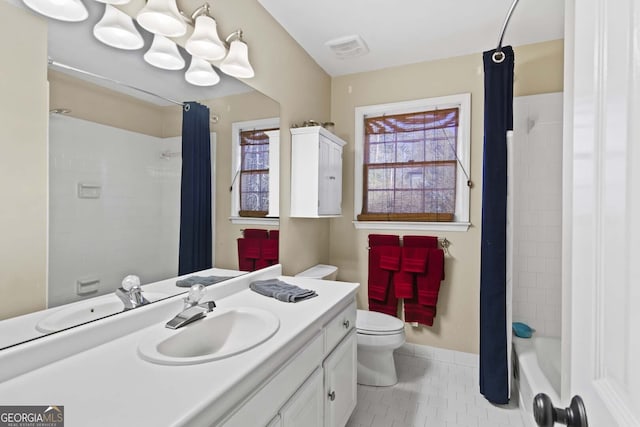 full bath with toilet, tile patterned floors, visible vents, and plenty of natural light